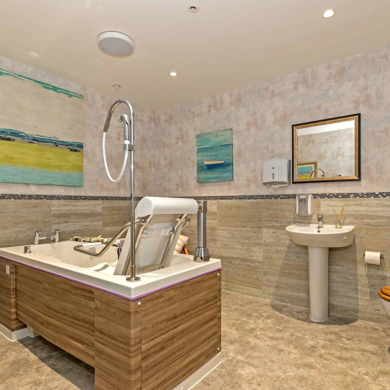 Bathroom with special seated bath at Oakland Care Home in Eastbourne