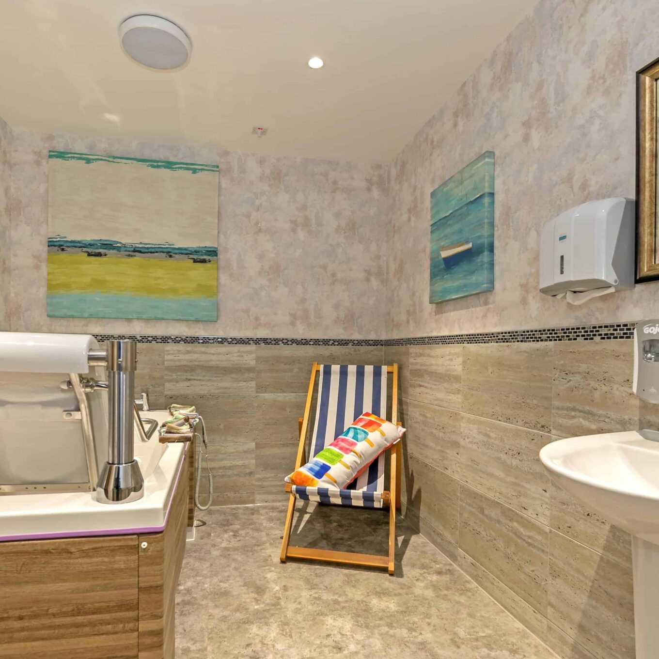 Bathroom with deck chair and bath at Beechwood Grove Care Home