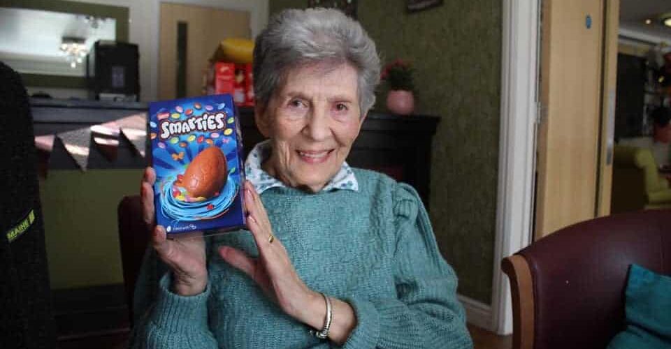 Doreen smiling with Easter Egg she found in the Easter Egg Hunt