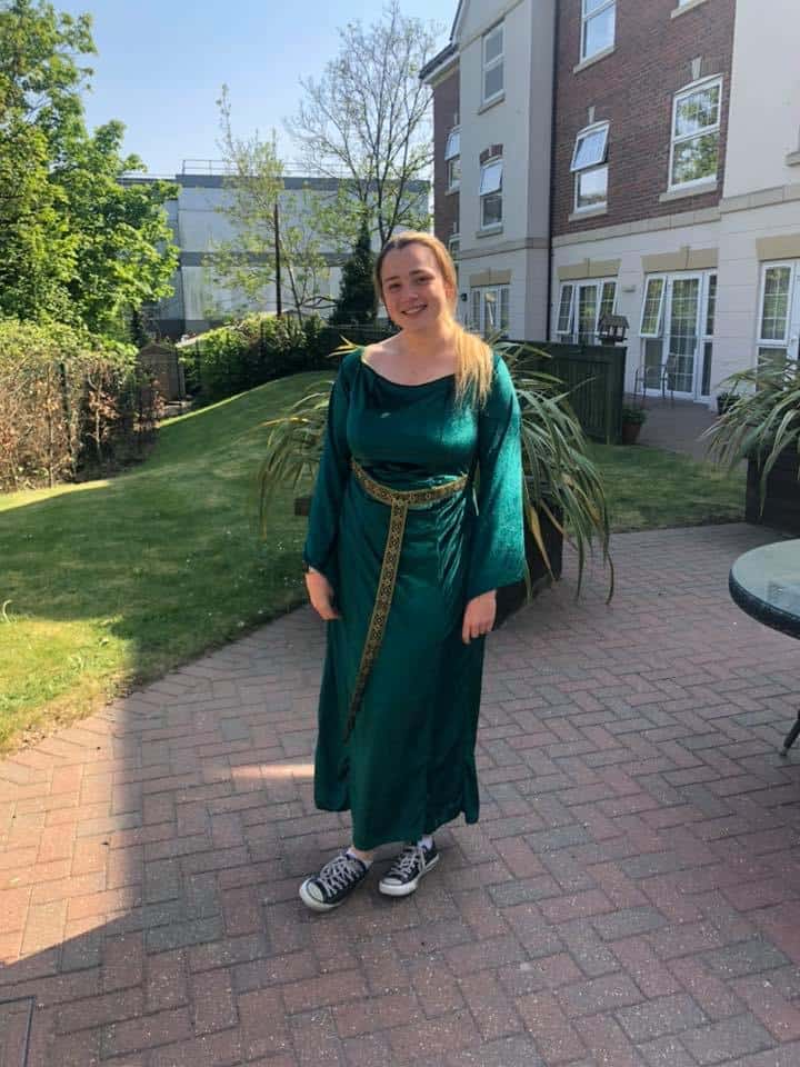 Lifestyles Assistant Kiera Helsey dressed up in a dragon outfit