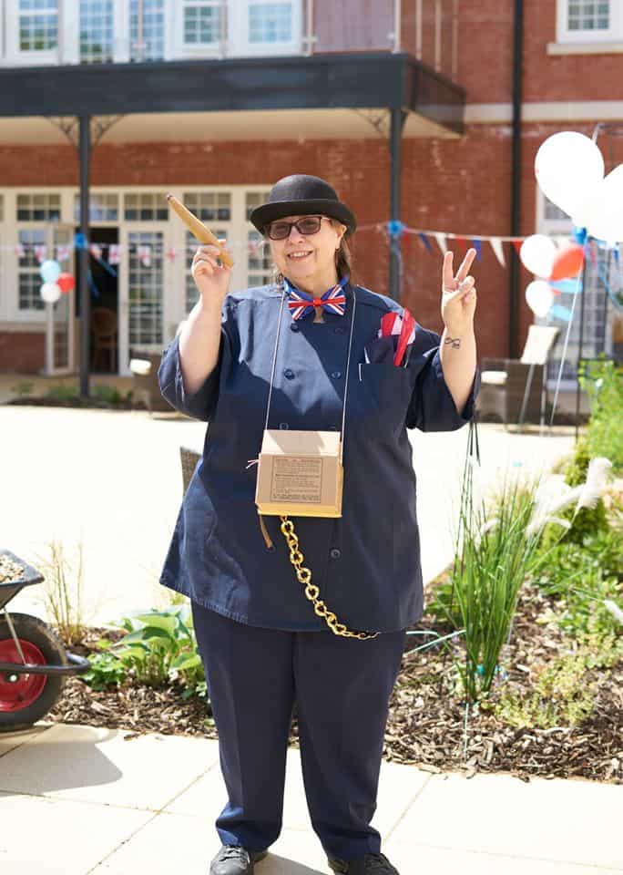 staff member dressed up as Winston Churchill for VE Day celebrations