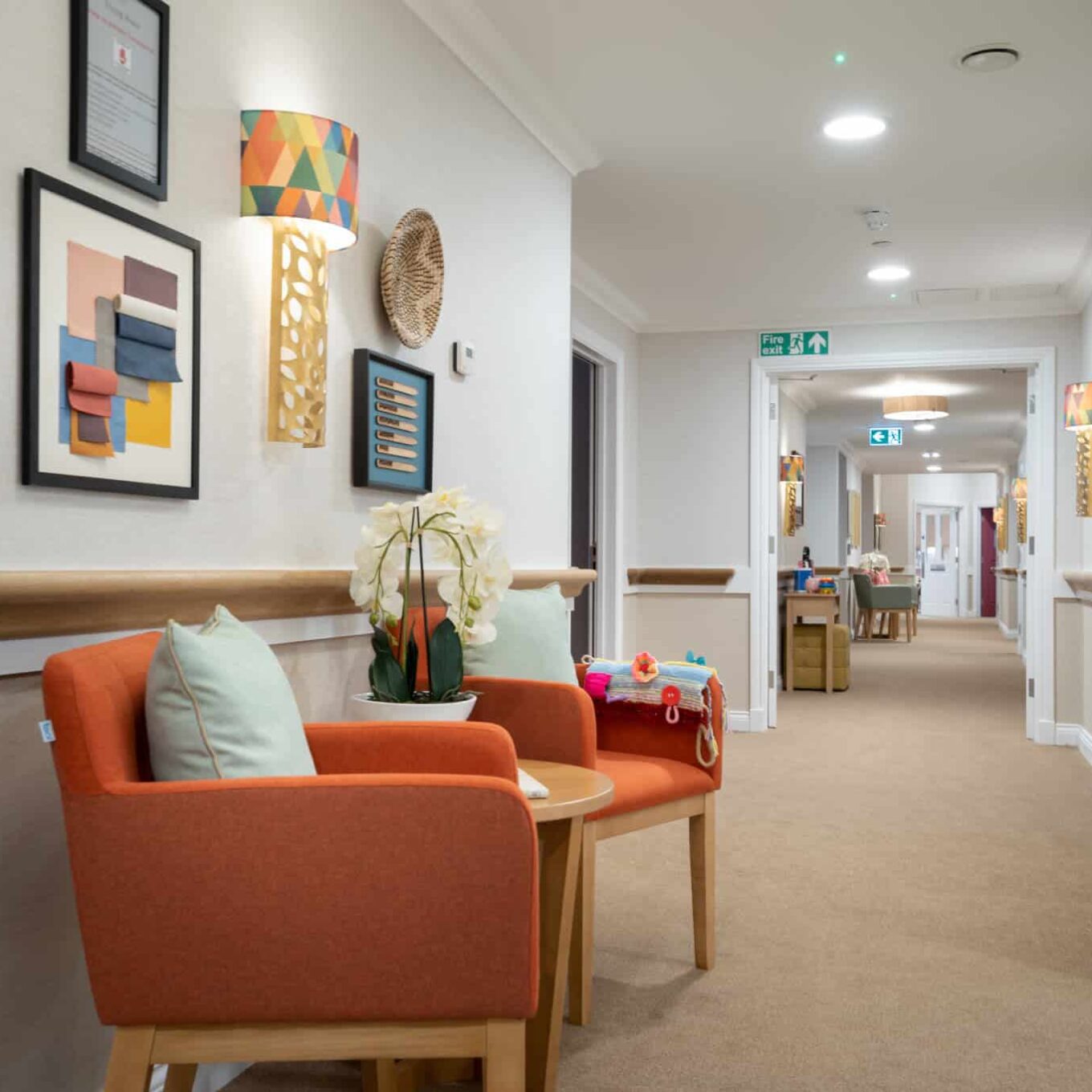 Corridor with artwork on the wall at Elsyng House Care Home in Enfield