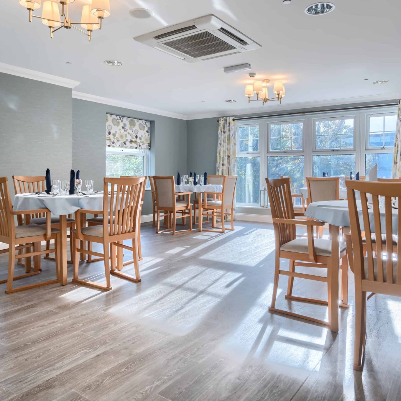 Dining room with table and chairs at Woodland Grove Care Home in Loughton