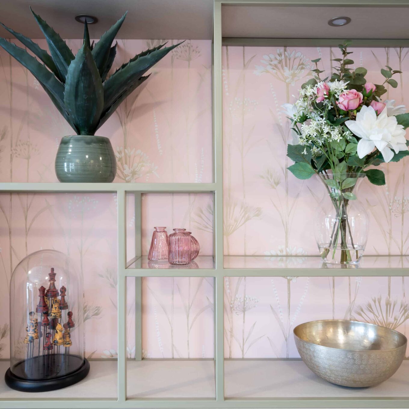 Ornaments and flowers on shelves in care home
