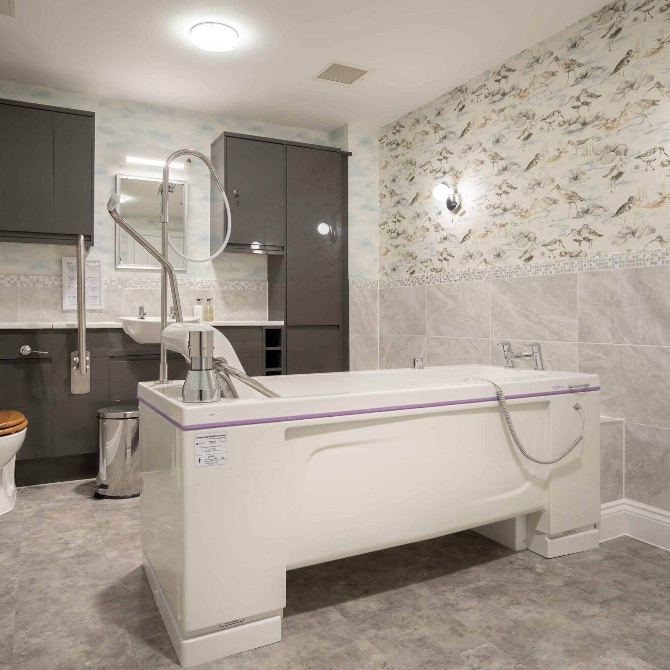 Large bathroom with bath inside room at Elmbook Court Care Home in Wantage, Oxfordshire