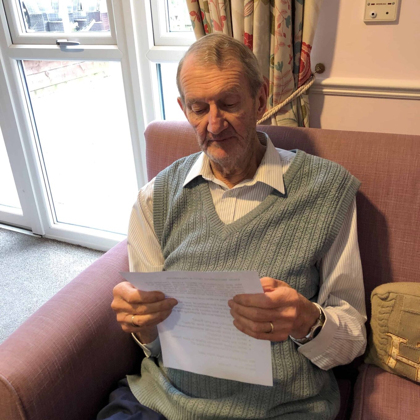 Resident Tony reading letter sent by young people