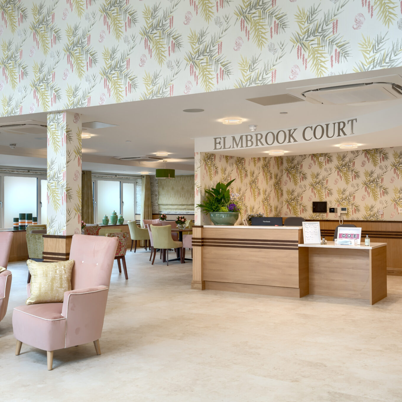 Reception room with chairs and tables at Elmbook Court Care Home in Wantage