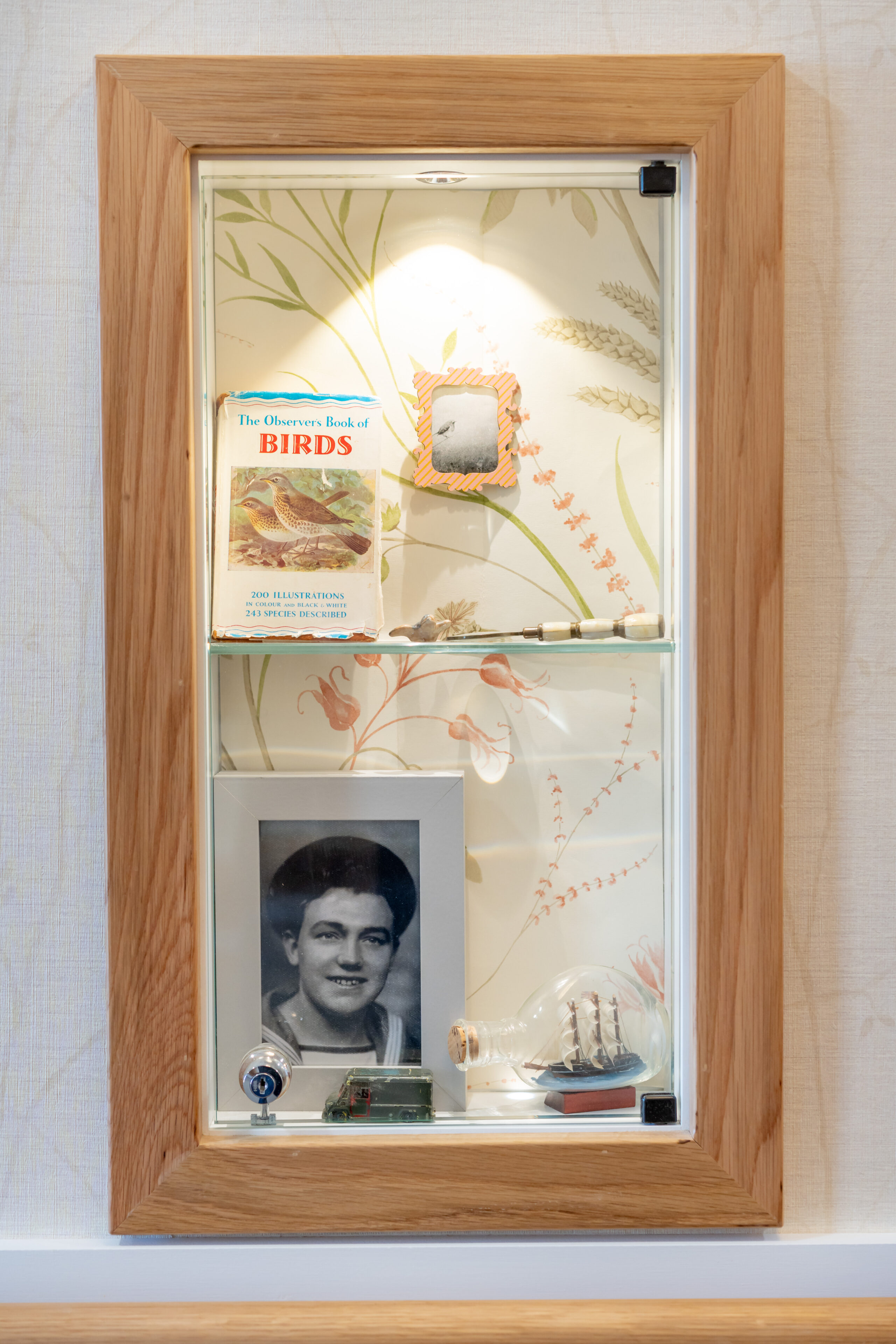 Memorabilia inside glass cabinet at Birchwood Heights Care Home in Swanley