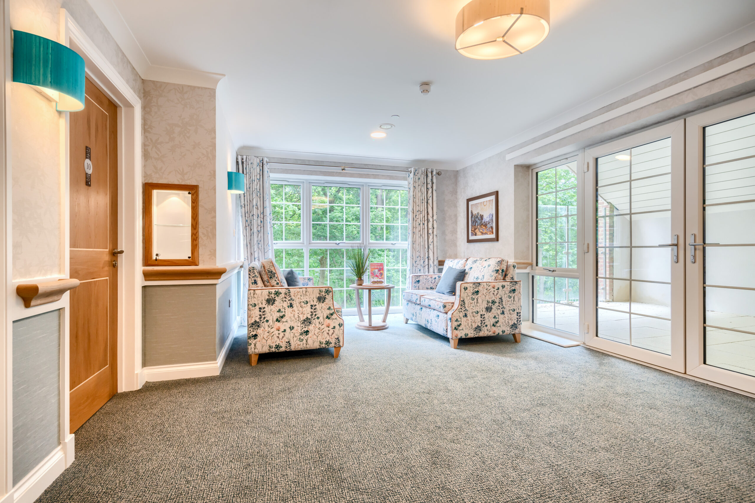 Birchwood Heights hallway with sofas and chair
