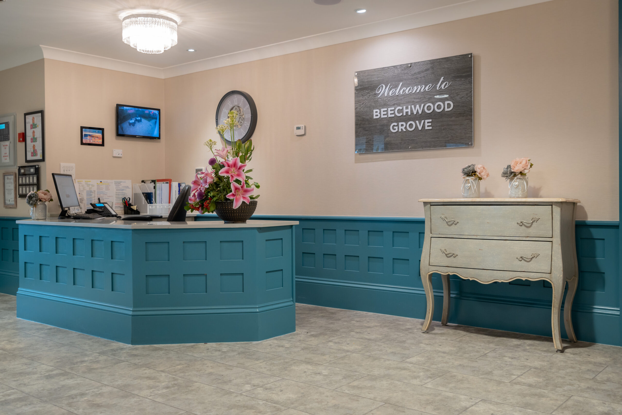 Beechwood Grove Care Home reception area with welcome sign on wall
