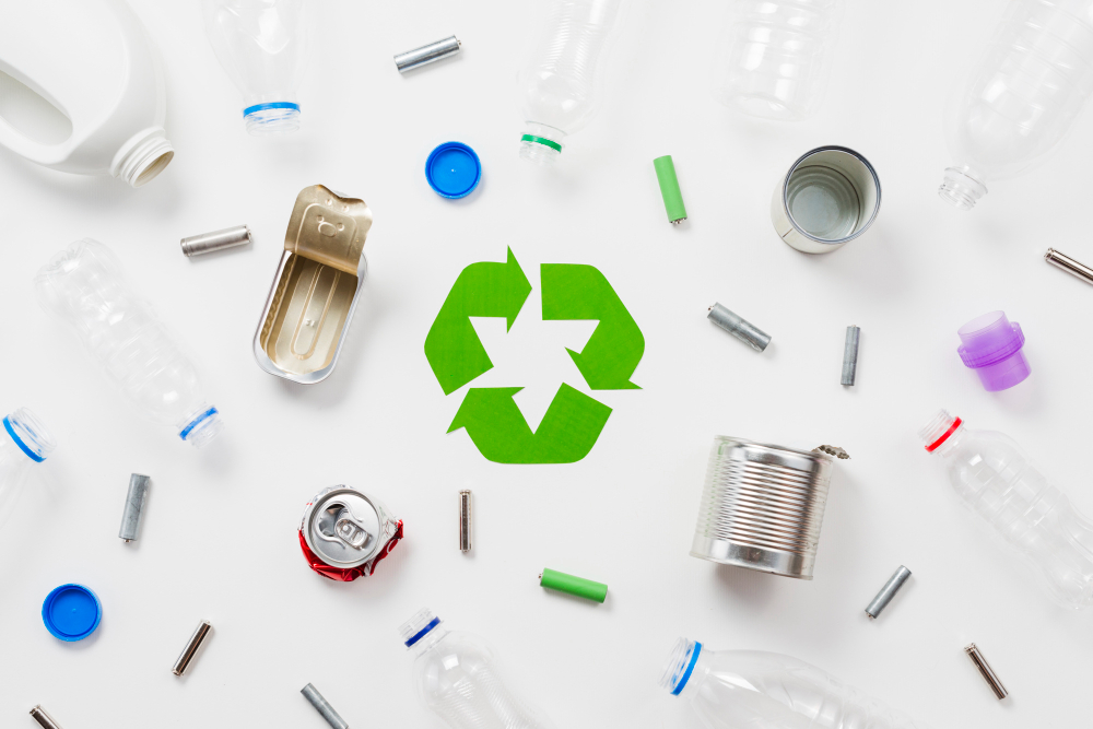 Types of recyclable objects with recyclable logo in middle